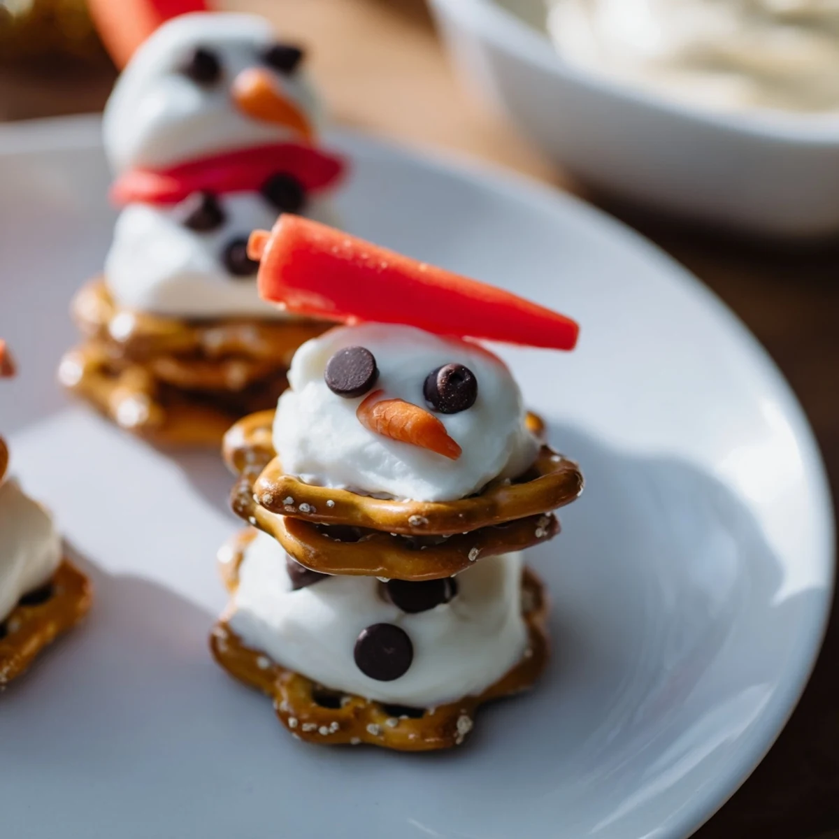 Festive Snowman Pretzel and Dip Platter, a delightful snack, with pretzel snowmen and creamy dips.