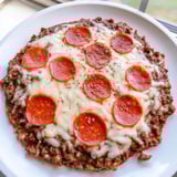 Golden pepperoni topping the Meat Pizza Pepperoni Stack after baking, ready to be sliced and served.