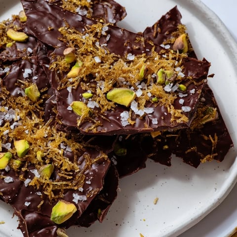 Golden kataifi chocolate crunch bark, a close-up showing crispy pieces and chopped pistachios.