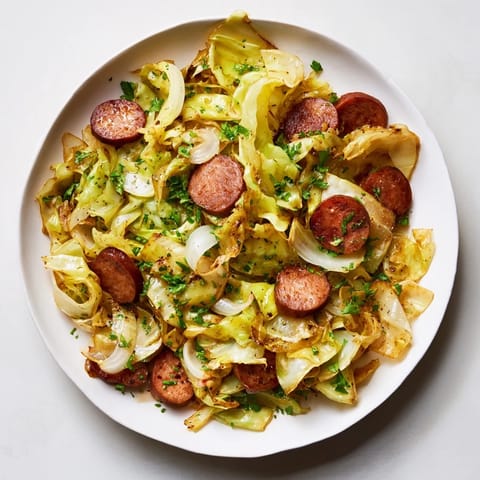 Savory Crispy Cabbage & Sausage Skillet with sausage slices and tender cabbage, ready to serve.