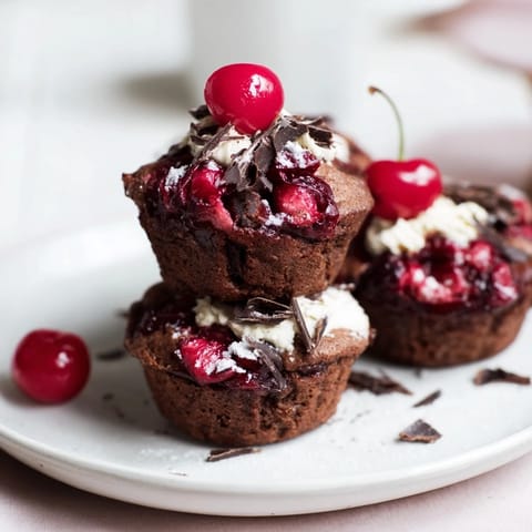 A close-up of decadent Black Forest Pancake Minis topped with chocolate shavings, ready to eat.