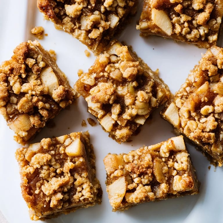 Golden-brown Apple Streusel Breakfast Bars with a buttery streusel topping, perfect for an afternoon snack.