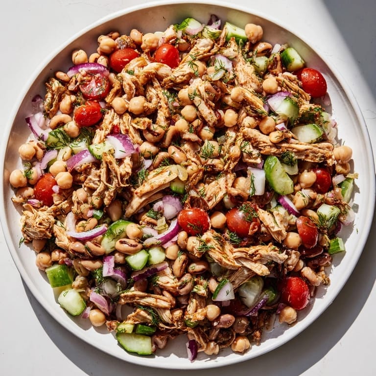 A close-up of a refreshing Dense Bean Salad with Lemon-Dill Chicken, perfect for a healthy lunch.
