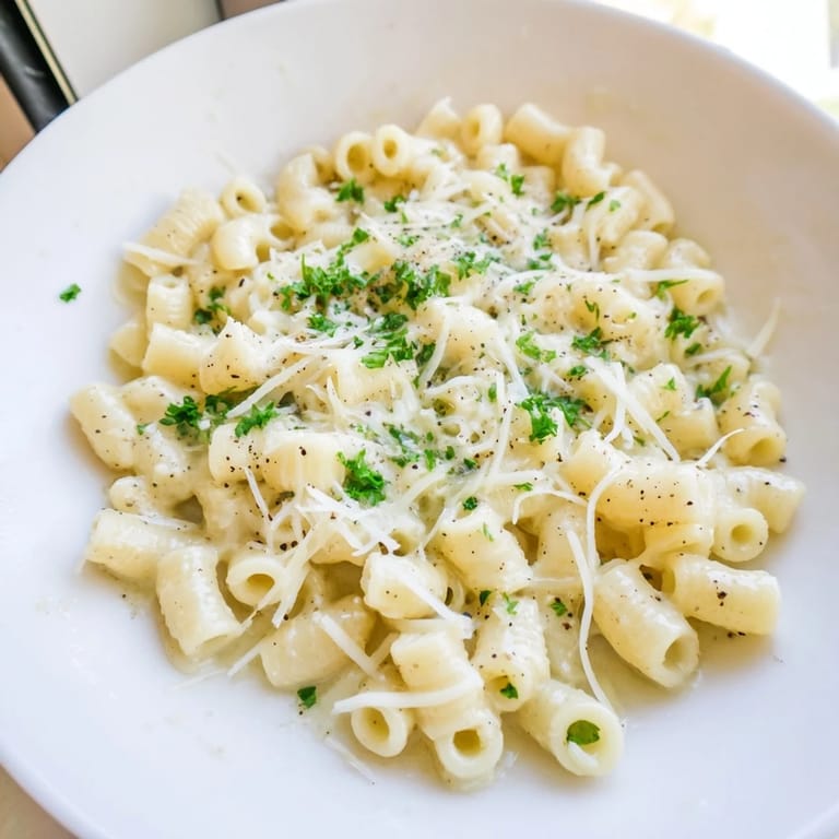 Close-up of creamy 15-Minute Garlic Butter Ditalini, ready to serve with Parmesan and fresh parsley.